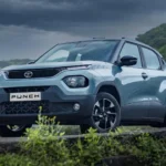 Compact car against a scenic backdrop